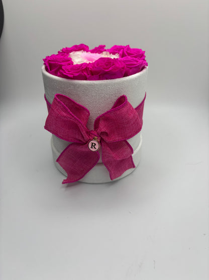 Mini evil eye in a round velvet box with a bow and initial charm