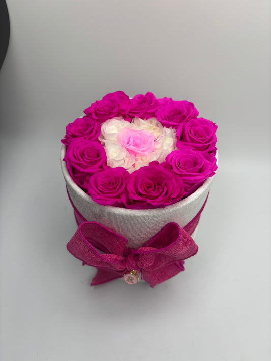 Mini evil eye in a round velvet box with a bow and initial charm